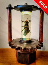 Steampunk Art Alchemy lamp for sale: Decorative piece of art with taxidermy insect.